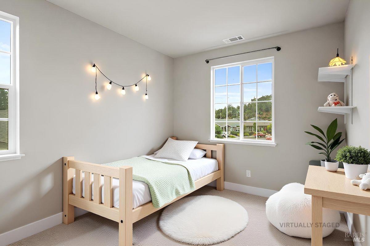 3566 Aaron Drive Santa Rosa, CA 95404 - Photo 17 of 22 a bedroom with a bed and window