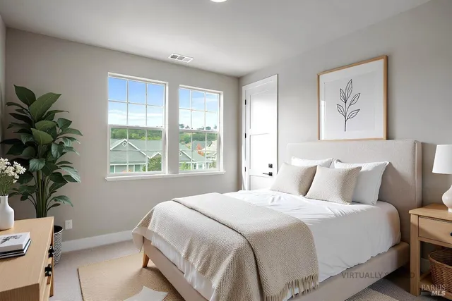 a bedroom with bed and a window