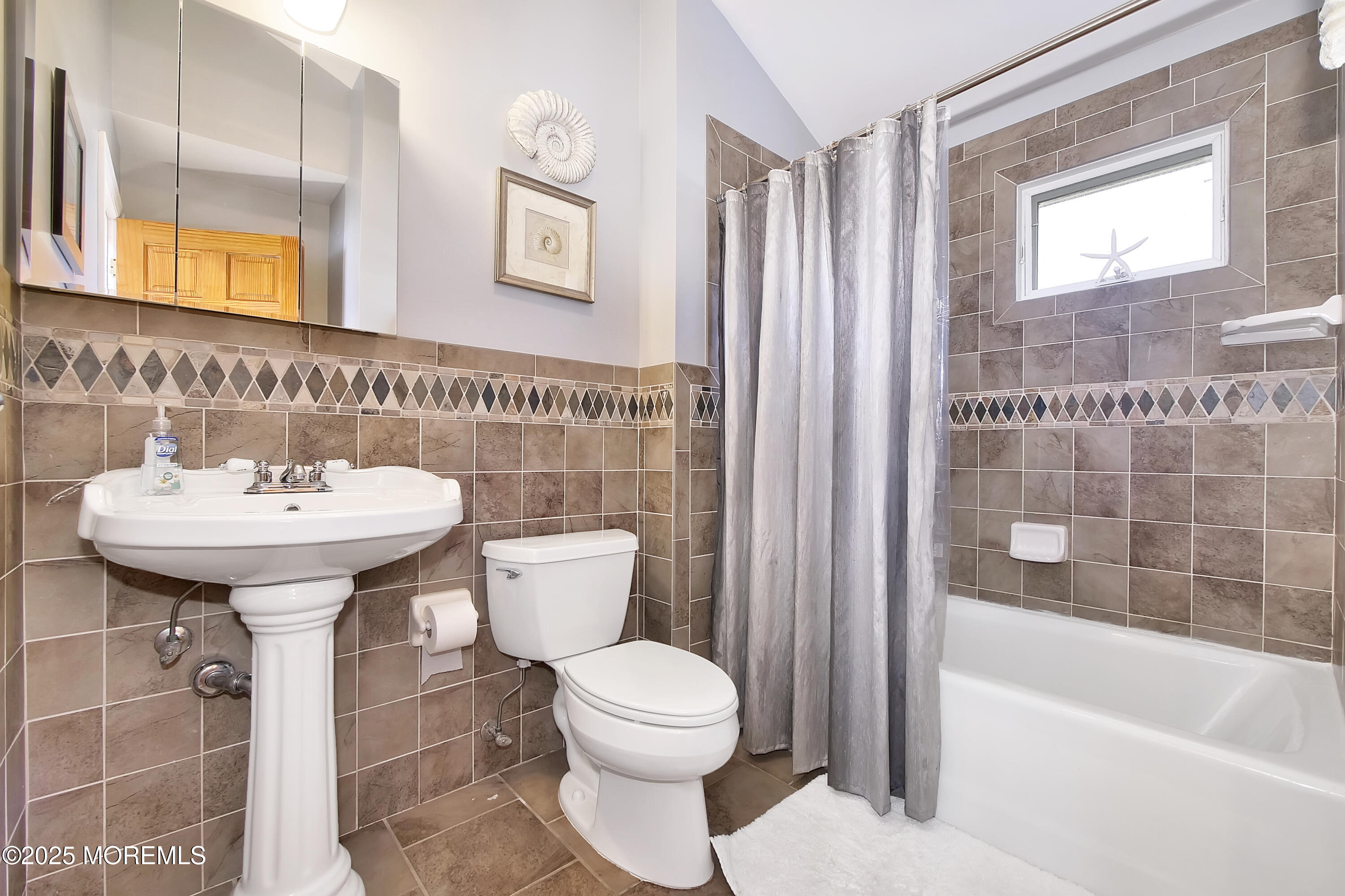 121 3rd Avenue Seaside Heights, NJ 08751 - Photo 5 of 20 a bathroom with a sink a toilet and shower