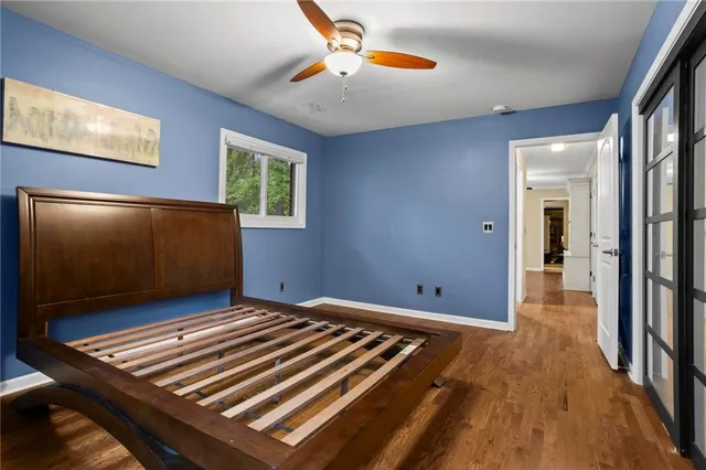 a bathroom with a sink a toilet and a window