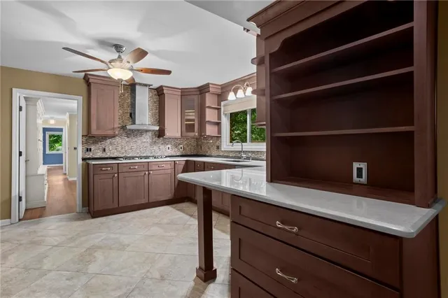 a kitchen with a cabinets and white appliances