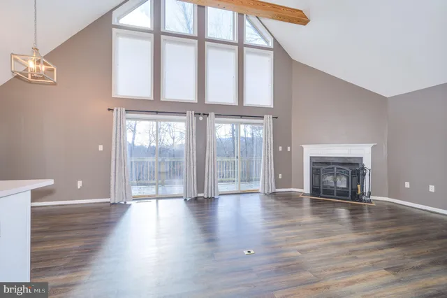 a view of fireplace and wooden floor