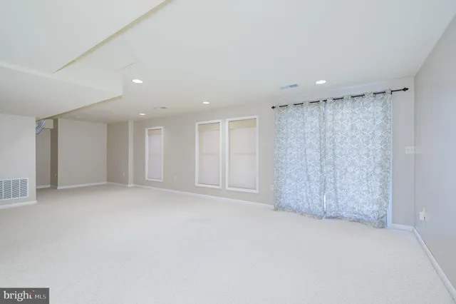 a backyard of a house with outdoor seating