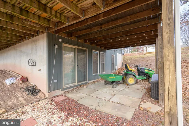 a view of balcony with wooden floor and fence