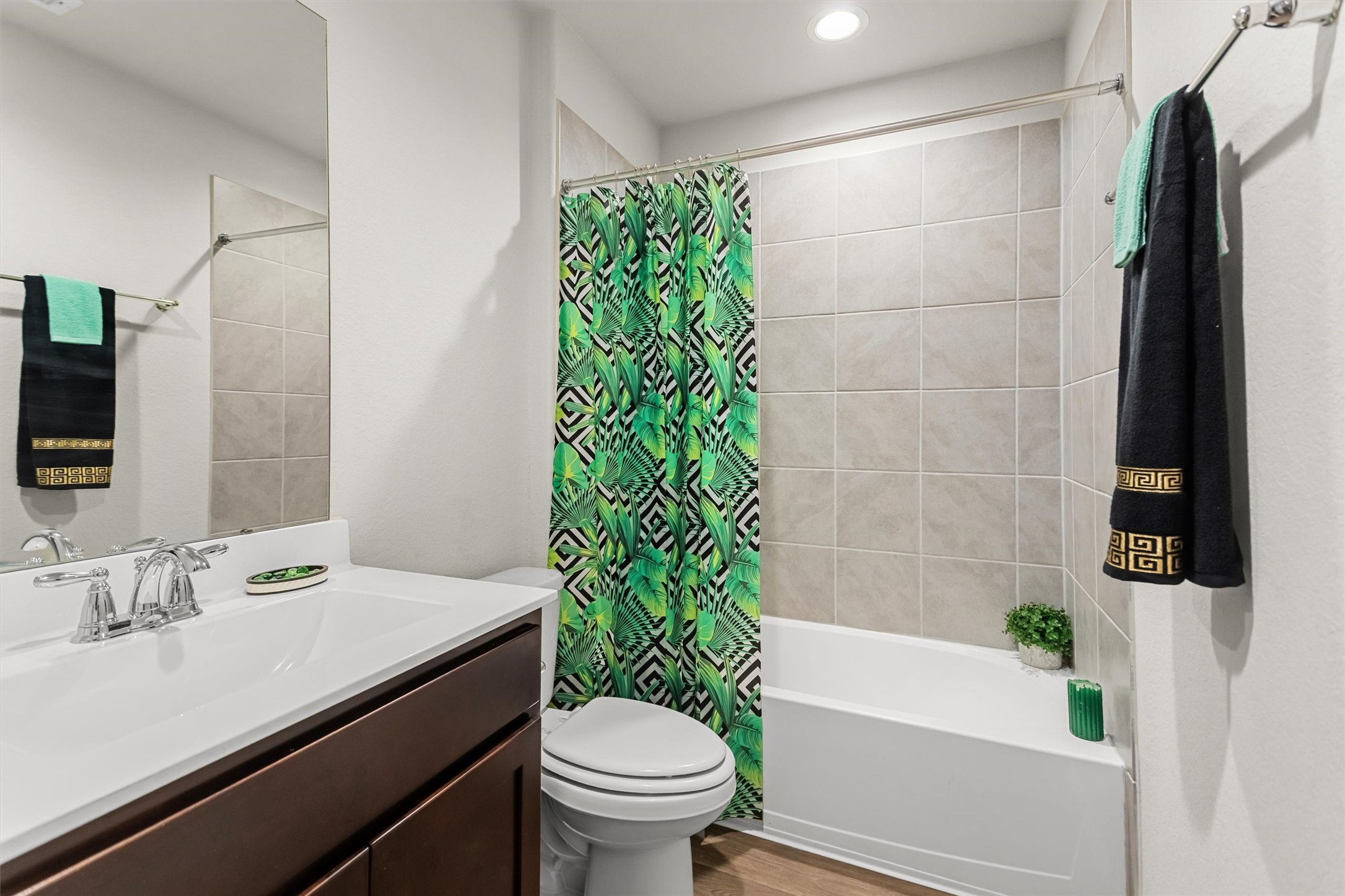 1711 Martin Spring Lane Rosenberg, TX 77469 - Photo 14 of 24 Secondary Bathroom featuring a spacious vanity and tub/shower combination with tile surround.