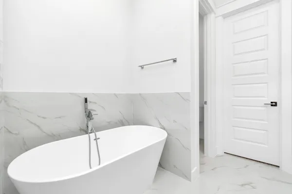 a bathroom with a white bath tub