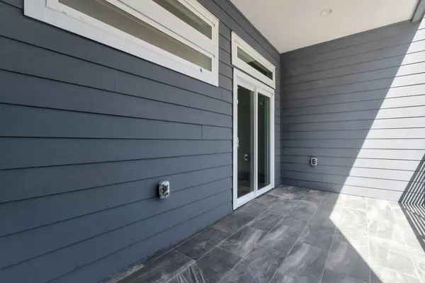 a view of a door and a window