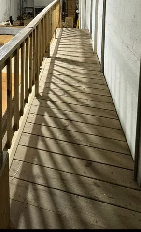 a view of a hallway with stairs