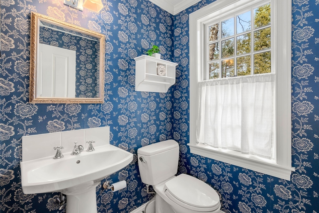 100 Oxford Road Westwood, MA 02090 - Photo 16 of 41 a bathroom with a sink a toilet and mirror