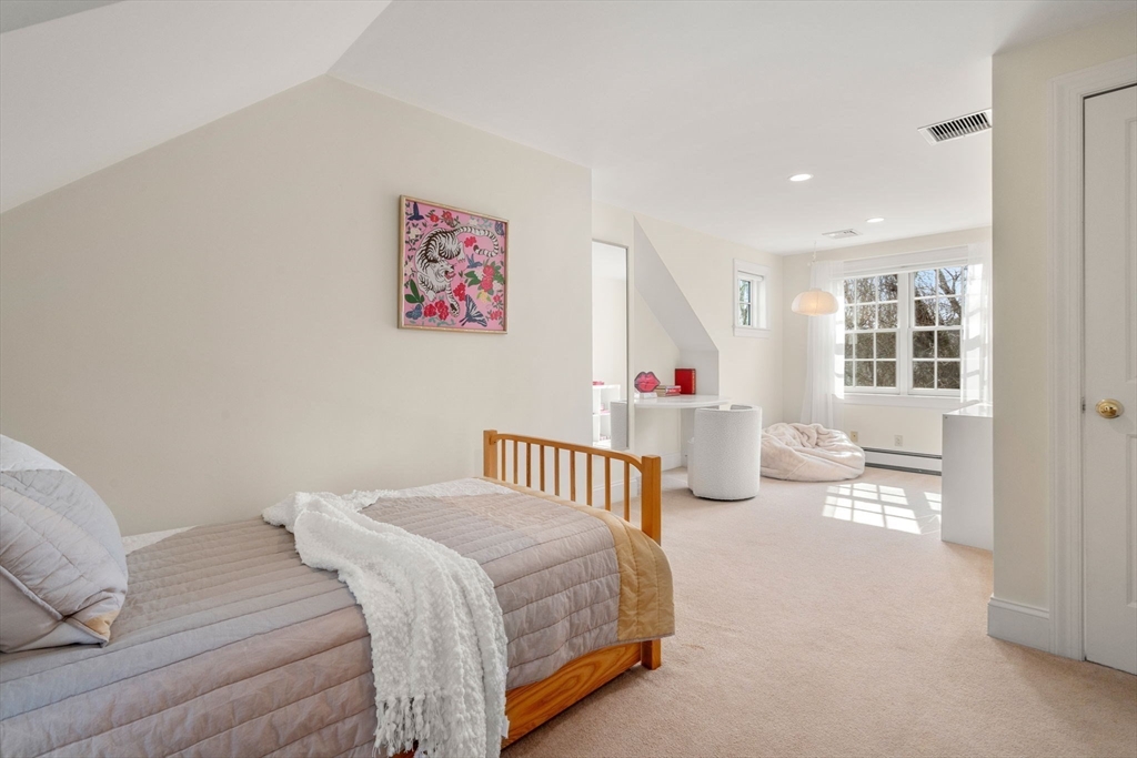 100 Oxford Road Westwood, MA 02090 - Photo 22 of 41 a bedroom with furniture and a table