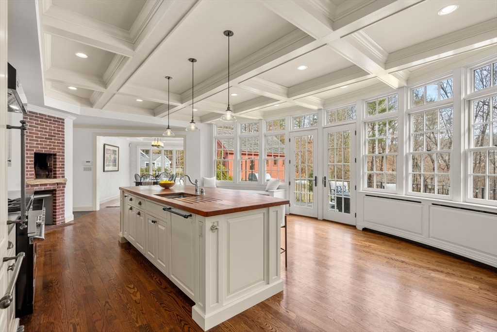 100 Oxford Road Westwood, MA 02090 - Photo 5 of 41 a kitchen with stainless steel appliances granite countertop a lot of counter space and wooden floors