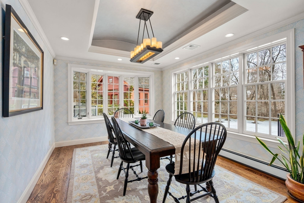 100 Oxford Road Westwood, MA 02090 - Photo 10 of 41 a view of a dining room with furniture wooden floor and chandelier