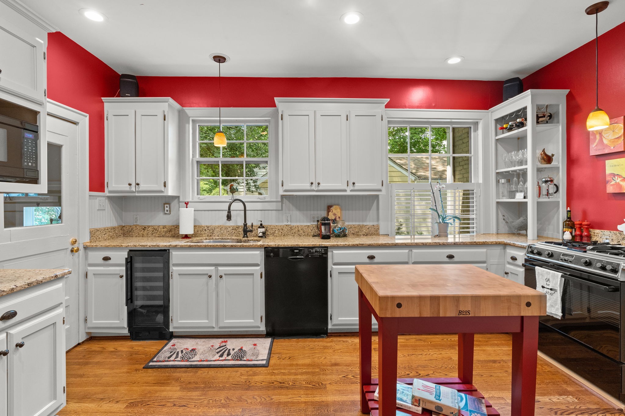 4117 Aberdeen Road Nashville, TN 37205 - Photo 14 of 46 a kitchen with stainless steel appliances kitchen island granite countertop a stove a sink and a microwave