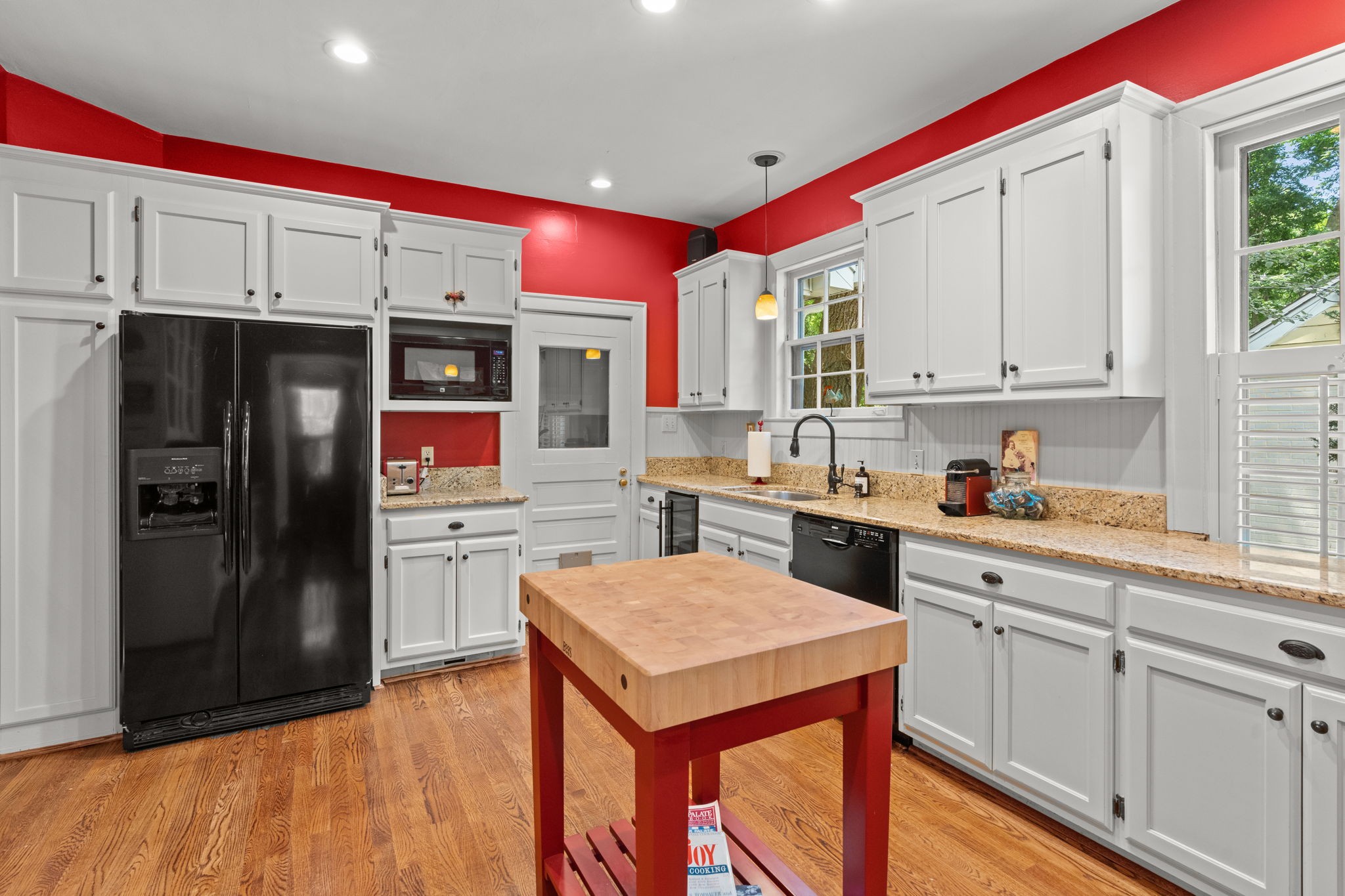 4117 Aberdeen Road Nashville, TN 37205 - Photo 16 of 46 a kitchen with stainless steel appliances kitchen island granite countertop a refrigerator a sink dishwasher and white cabinets with wooden floor