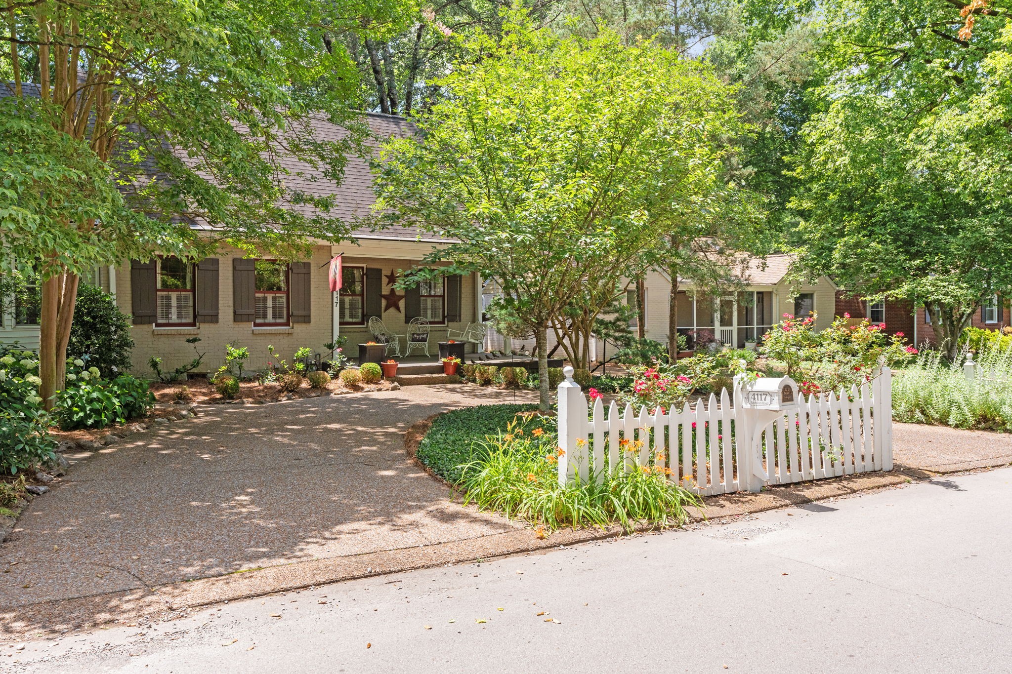 4117 Aberdeen Road Nashville, TN 37205 - Photo 2 of 46 a front view of a house with a garden