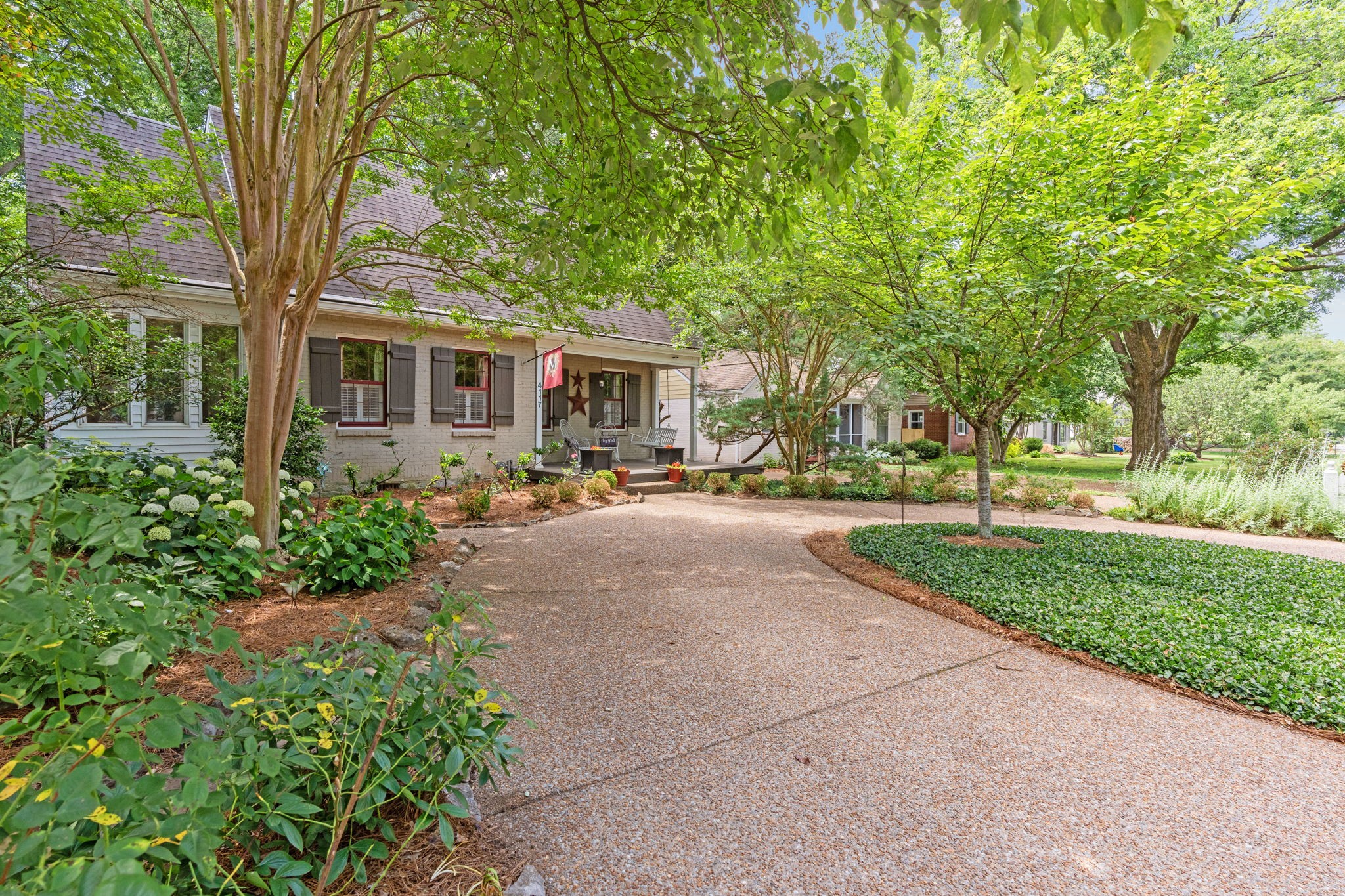 4117 Aberdeen Road Nashville, TN 37205 - Photo 3 of 46 a front view of a house with a yard and trees