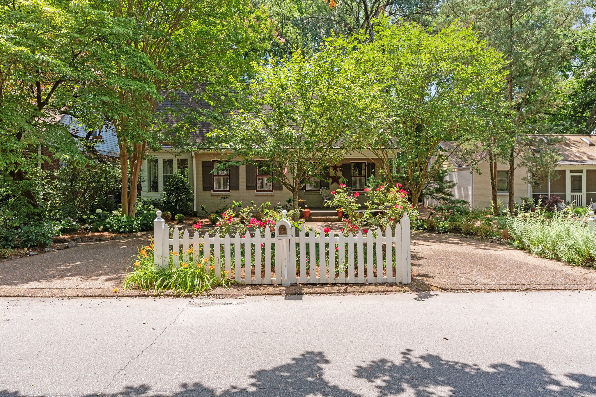 4117 Aberdeen Road Nashville, TN 37205 - Photo 4 of 46 a front view of a house with a garden