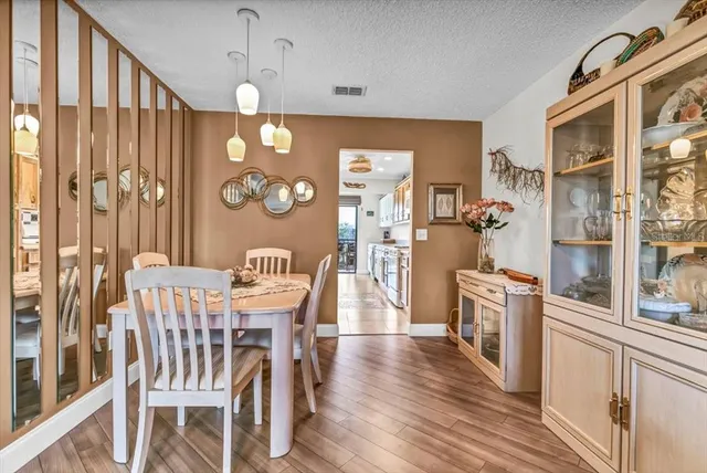 a kitchen with stove a sink and a refrigerator