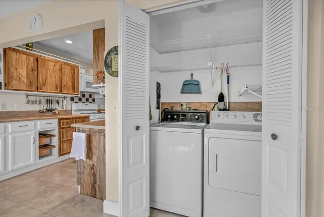 a dining room with furniture and front door view