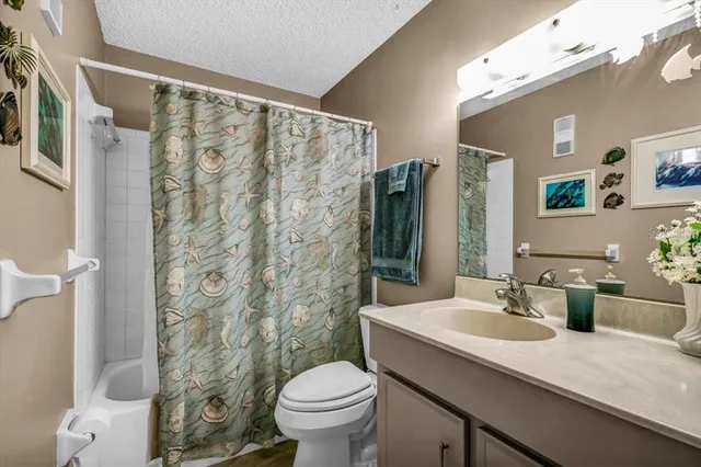 a bedroom with a bed and a tv