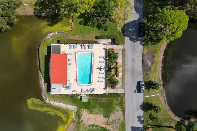 aerial view of a house with a yard