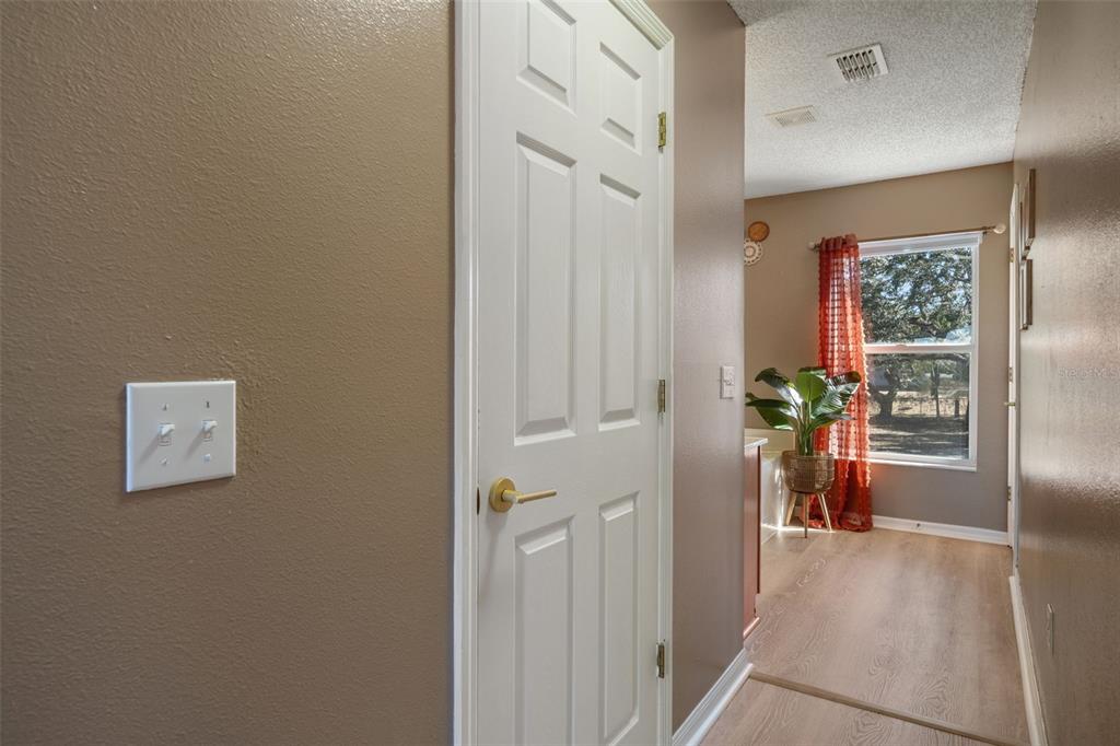 11258 Lomita Wren Road Weeki Wachee, FL 34614 - Photo 26 of 44 a view of a hallway to a livingroom and a dinning room