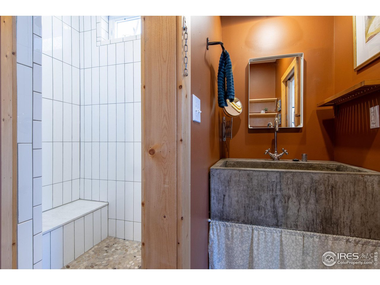 426 Park Street Lyons, CO 80540 - Photo 11 of 40 a bathroom with a granite countertop sink and a mirror