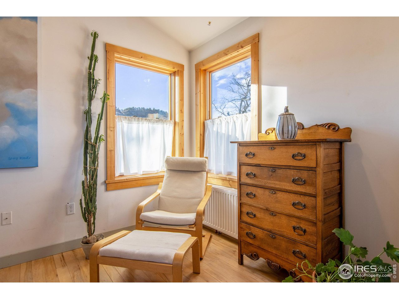 426 Park Street Lyons, CO 80540 - Photo 17 of 40 a view of a bedroom with furniture and windows