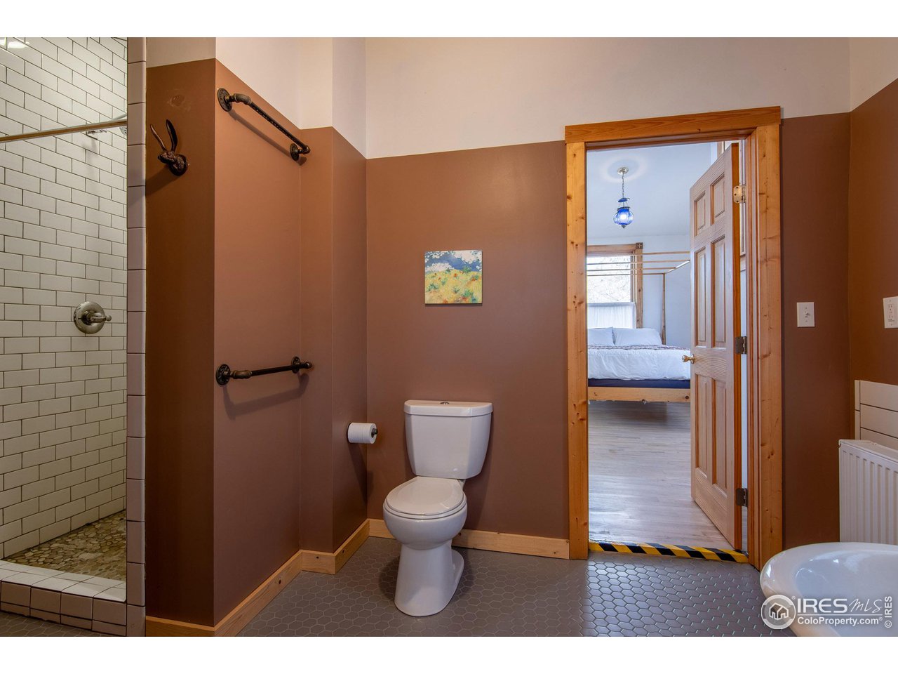 426 Park Street Lyons, CO 80540 - Photo 21 of 40 a bathroom with a toilet and a shower
