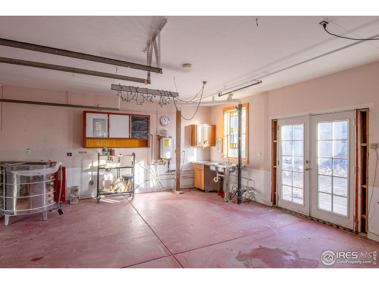 426 Park Street Lyons, CO 80540 - Photo 29 of 40 a living room with furniture and a flat screen tv