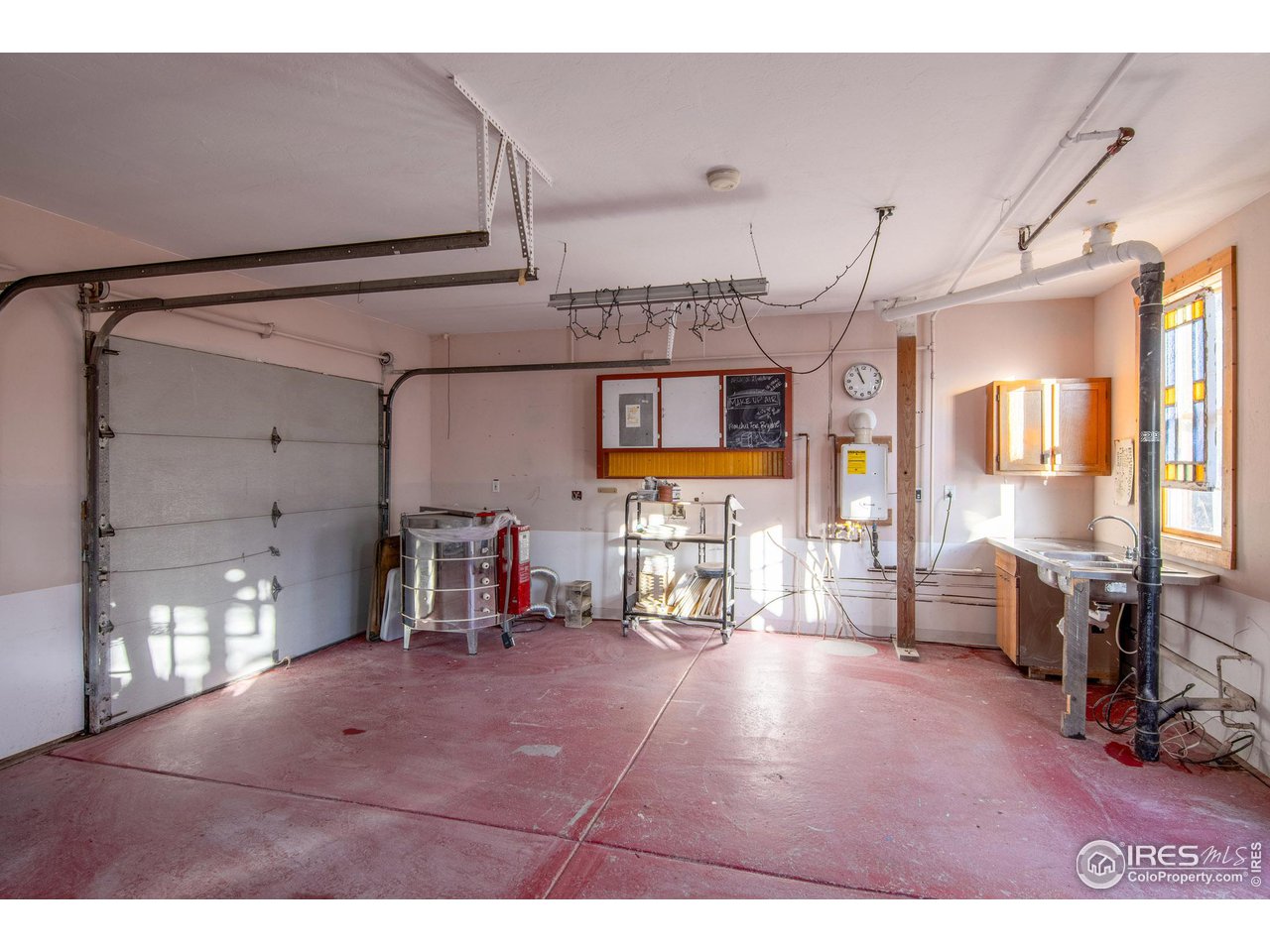426 Park Street Lyons, CO 80540 - Photo 30 of 40 a living room with furniture and a flat screen tv
