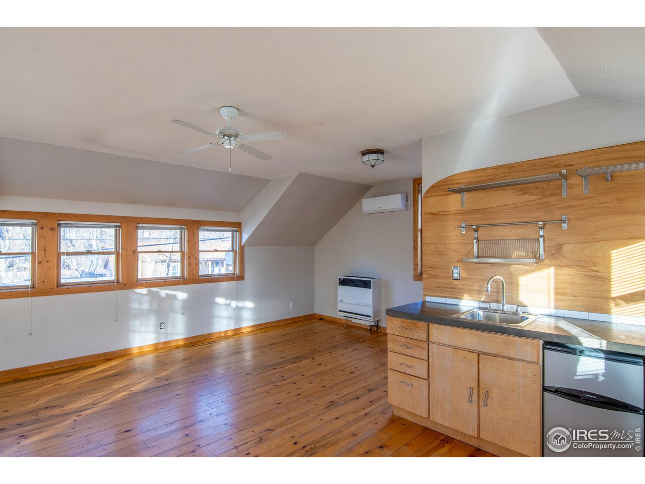 426 Park Street Lyons, CO 80540 - Photo 31 of 40 a kitchen with a sink and wooden floor