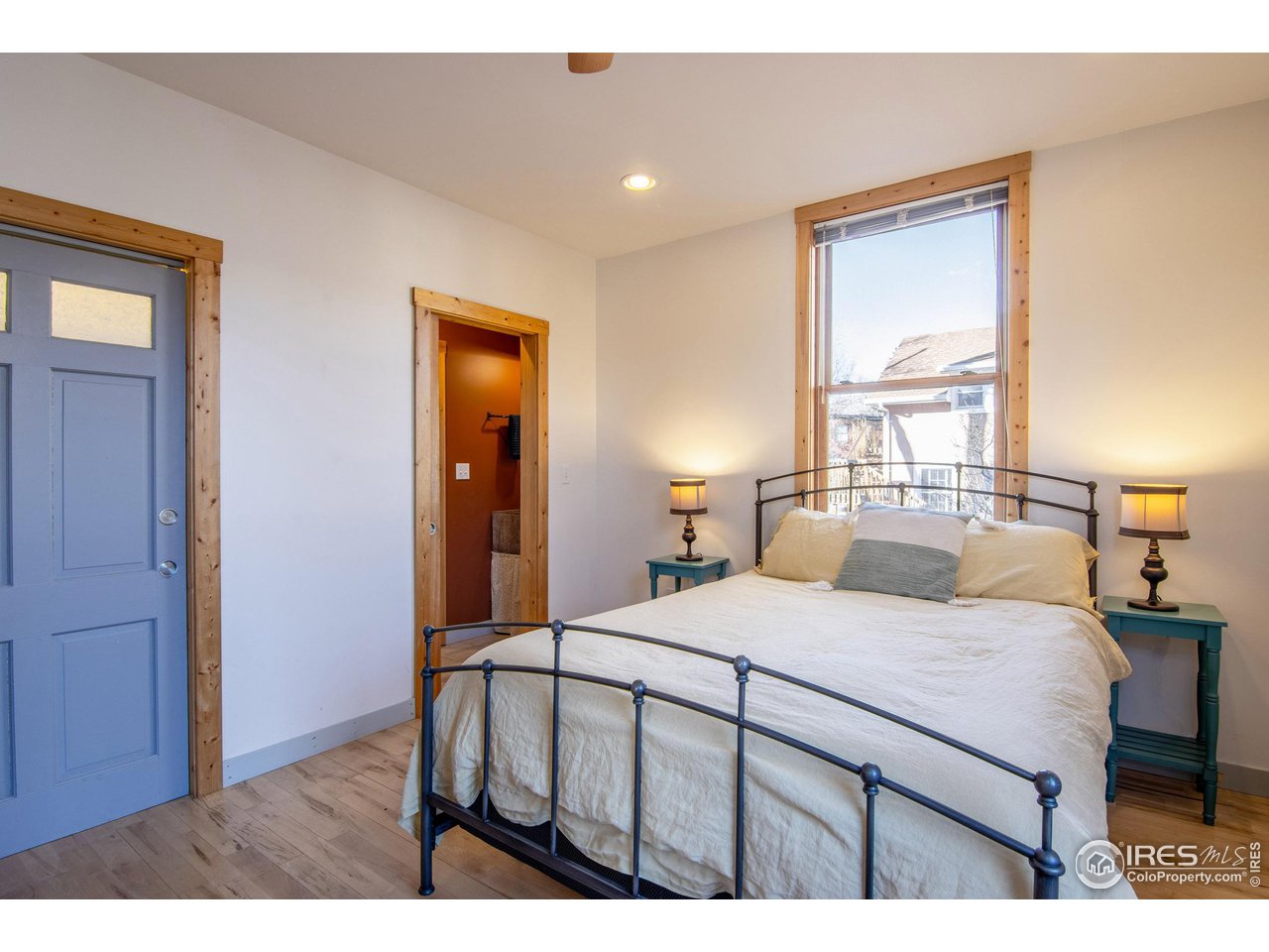 426 Park Street Lyons, CO 80540 - Photo 9 of 40 a bedroom with a bed and a dresser