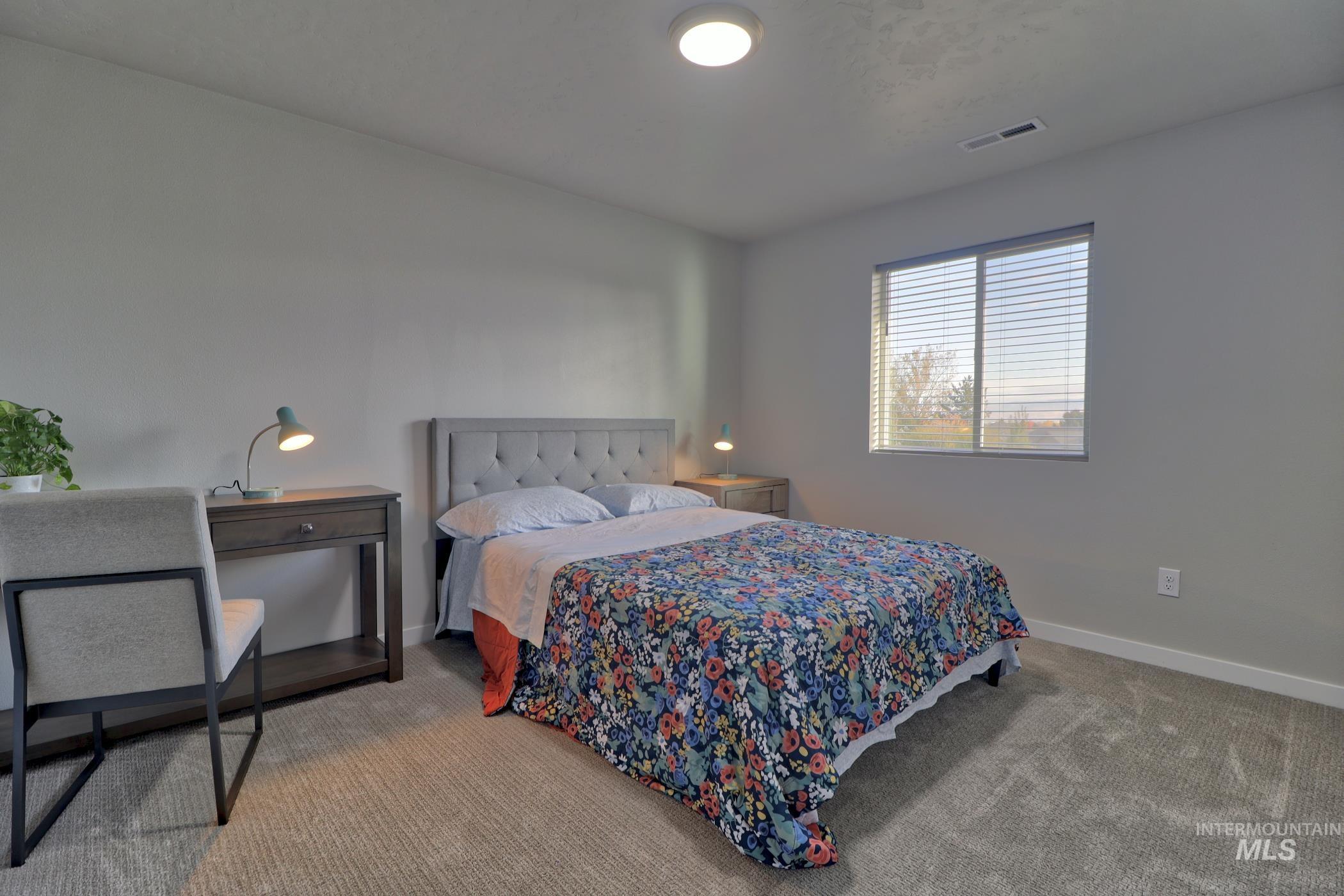 3508 South Edge Rim Way Meridian, ID 83642 - Photo 12 of 28 Neutral tone walls with soft gray carpeting