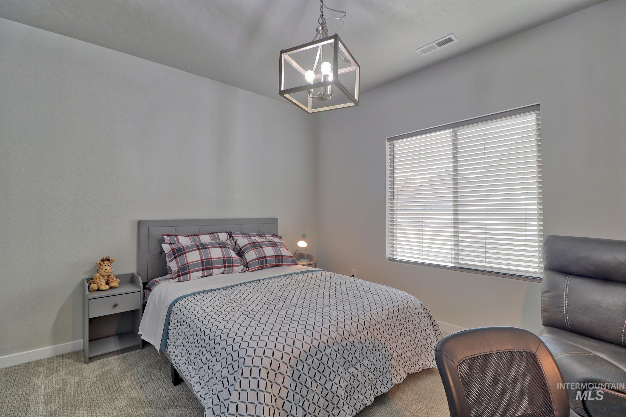 3508 South Edge Rim Way Meridian, ID 83642 - Photo 16 of 28 Bedroom featuring neutral-toned walls, recessed lighting, and a large window with horizontal blinds
