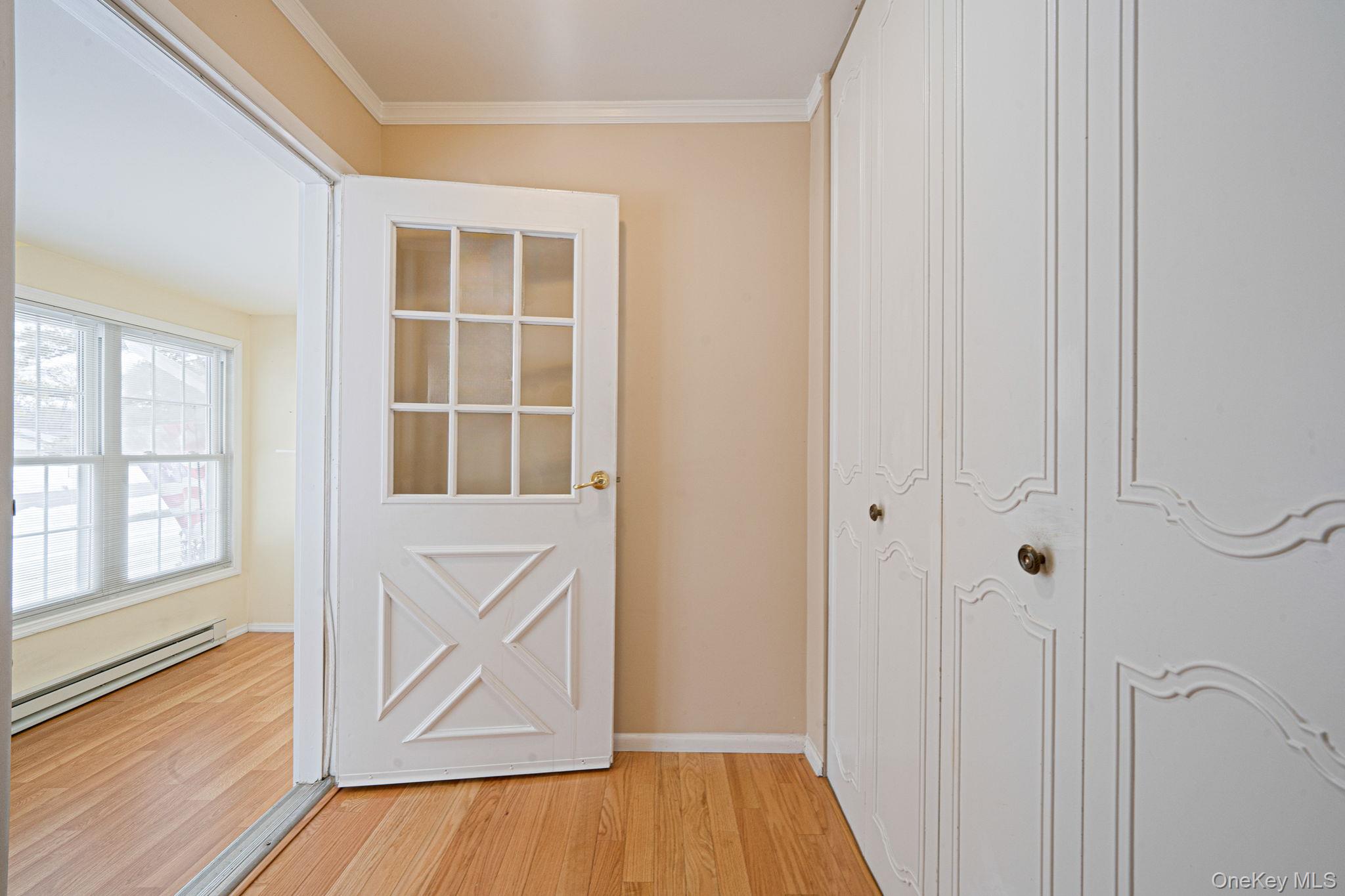 61 Enfield Court, Unit B Ridge, NY 11961 - Photo 18 of 32 a view of front door with hallway