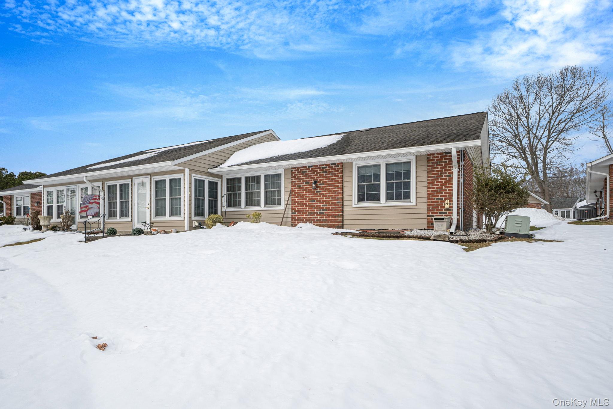 61 Enfield Court, Unit B Ridge, NY 11961 - Photo 4 of 32 a view of a house with a outdoor space