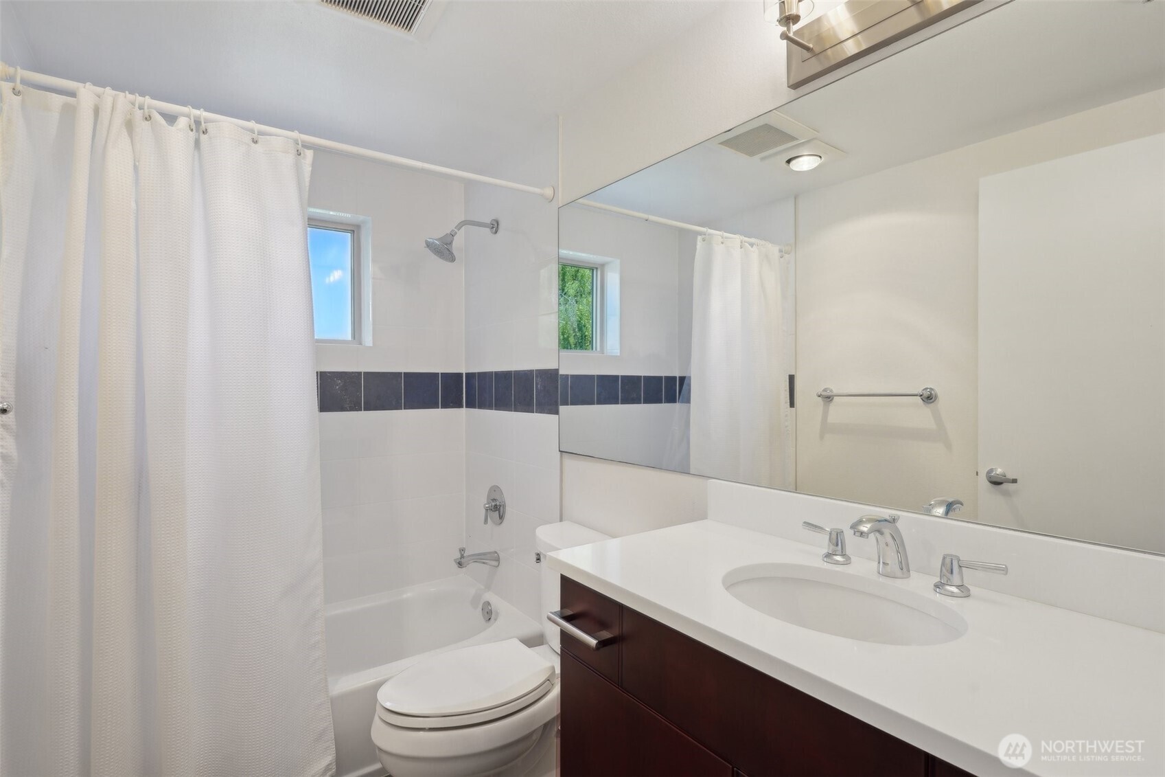 701 Galer Street, Unit 504 Seattle, WA 98109 - Photo 15 of 28 a bathroom with a sink a toilet and shower