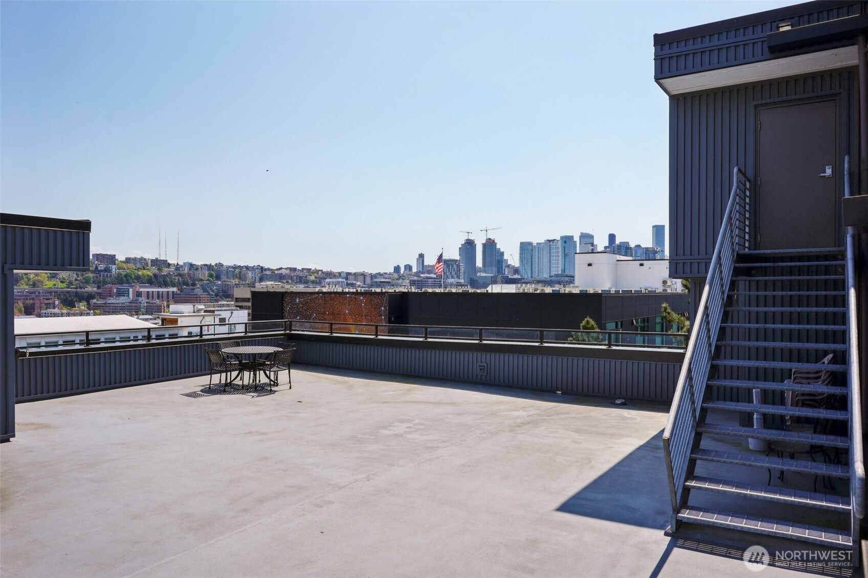 701 Galer Street, Unit 504 Seattle, WA 98109 - Photo 18 of 28 a view of a terrace with chairs