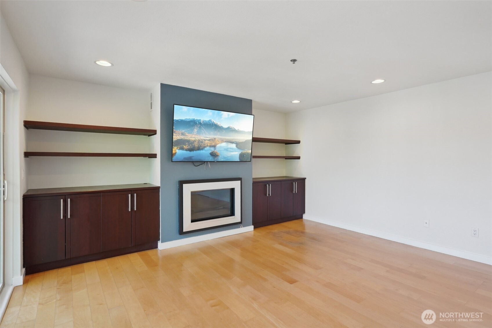 701 Galer Street, Unit 504 Seattle, WA 98109 - Photo 2 of 28 a view of an empty room with a fireplace