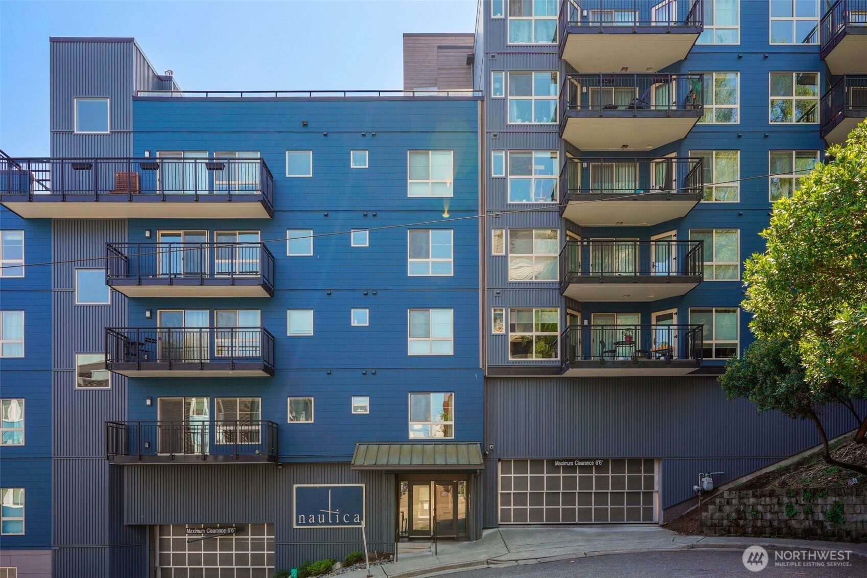 701 Galer Street, Unit 504 Seattle, WA 98109 - Photo 26 of 28 a front view of a building with many windows