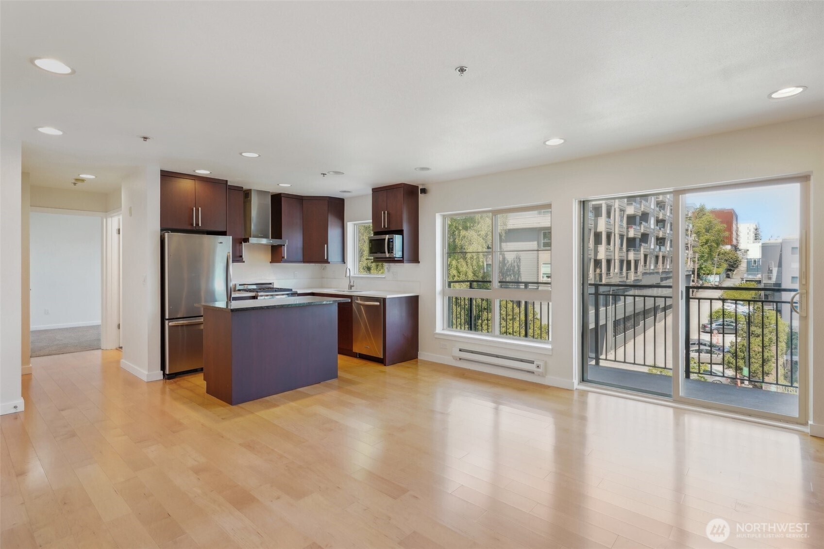 701 Galer Street, Unit 504 Seattle, WA 98109 - Photo 5 of 28 a large kitchen with a large window and a refrigerator
