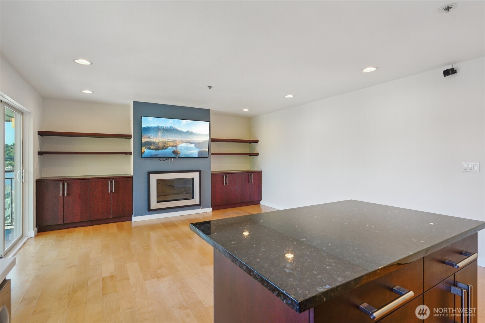 701 Galer Street, Unit 504 Seattle, WA 98109 - Photo 8 of 28 an open kitchen with a sink and a fireplace