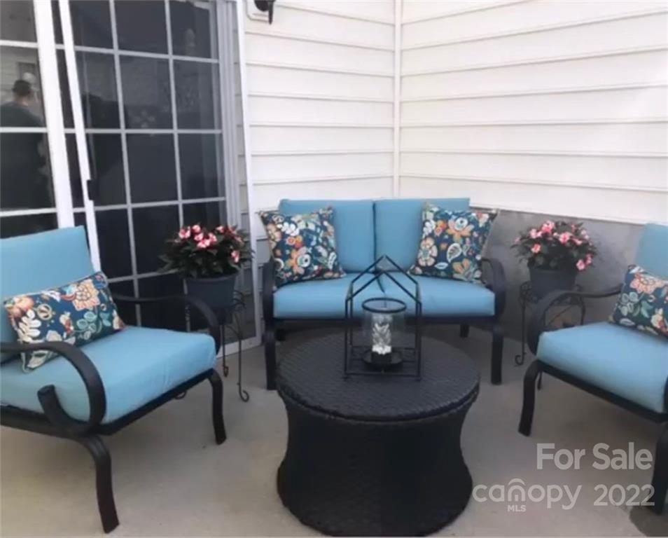 808 Gentlewinds Court Fort Mill, SC 29708 - Photo 24 of 24 a living room with furniture and flowers
