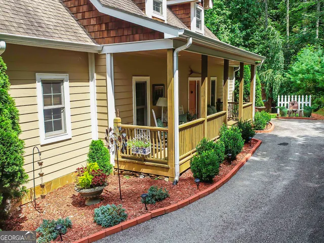 a kitchen with stainless steel appliances granite countertop a stove and a wooden floors