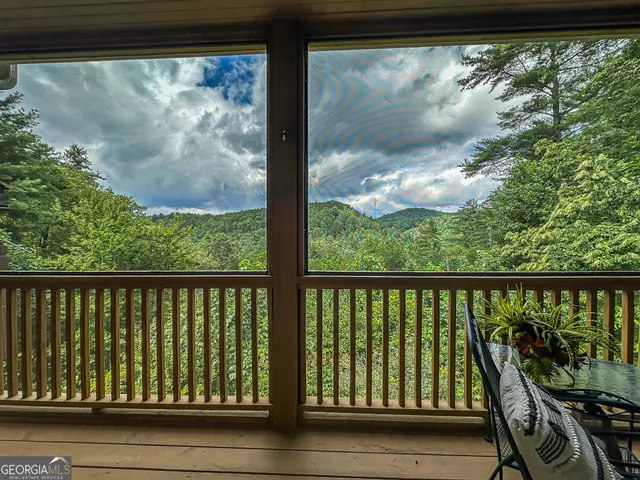 a bathroom with a granite countertop toilet a sink and a mirror