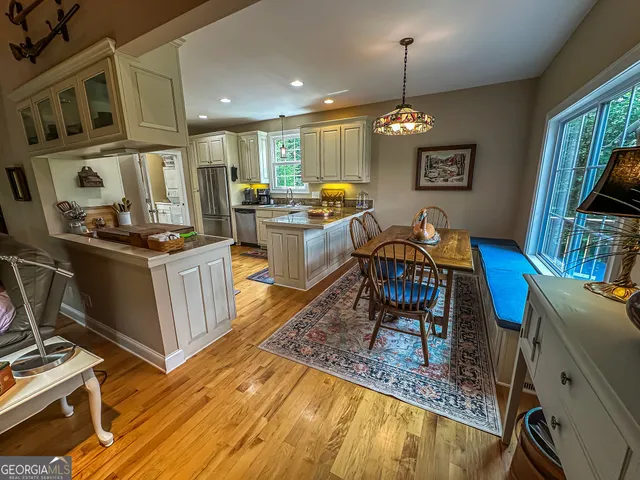a dining room with furniture and a chandelier