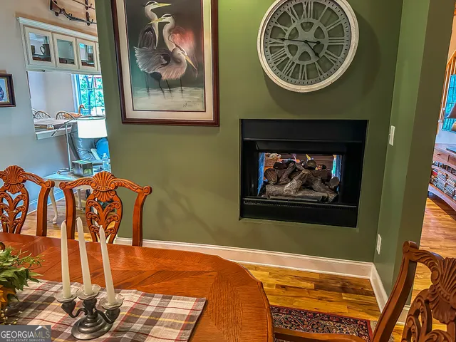 a bed room with a bed and a flat tv screen on dresser