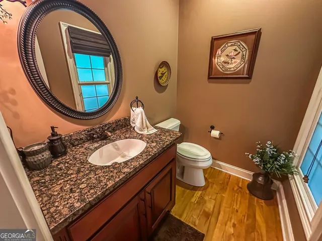 a bedroom with a bed and chair