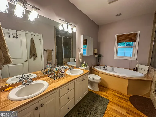 a view of a balcony with chairs and wooden floor